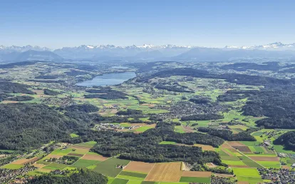 View over Switzerland with the Alps in the background.