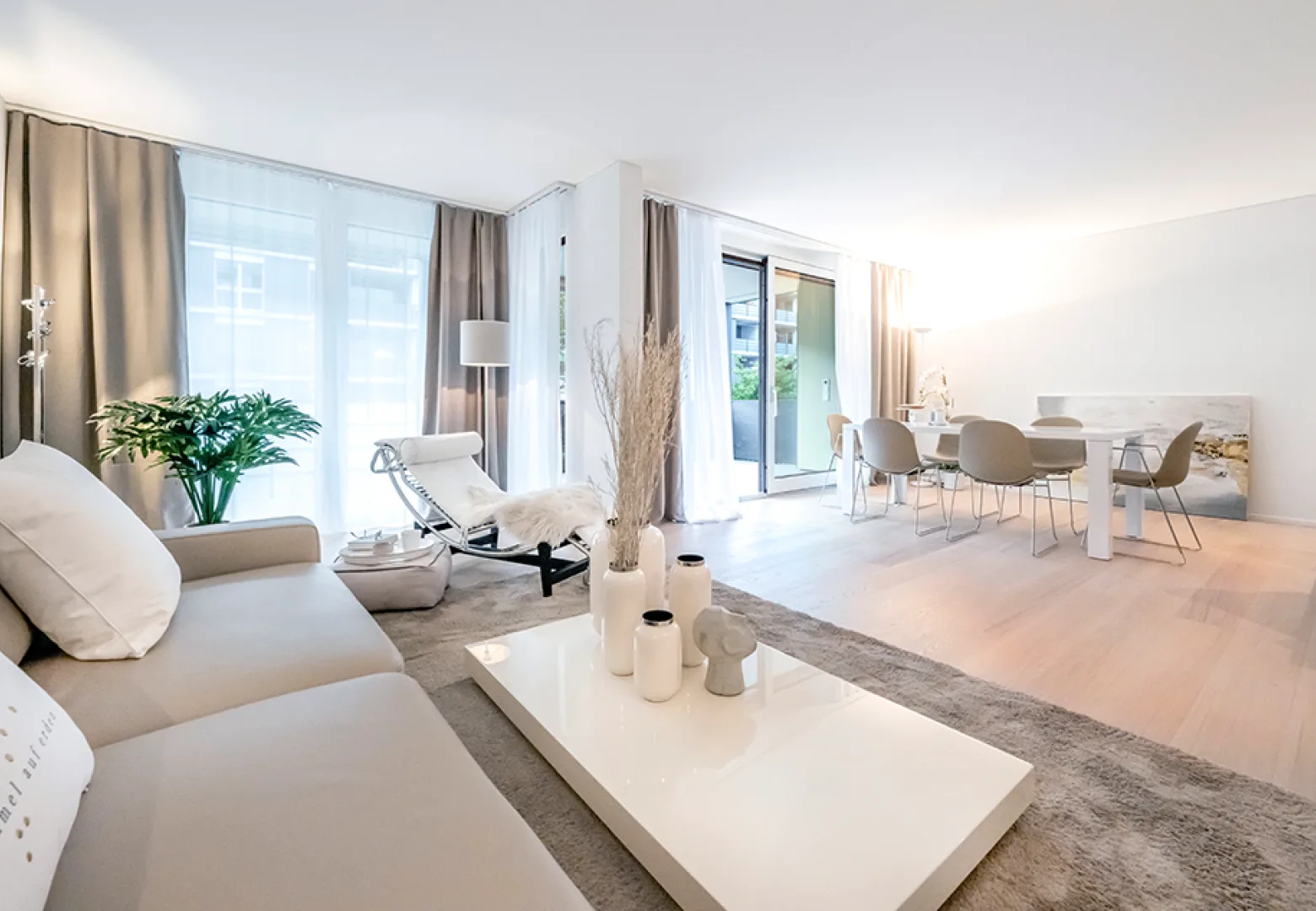 View from sofa into open dining room.